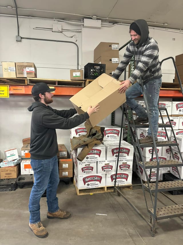 Manion Foods warehouse staff loading a delivery